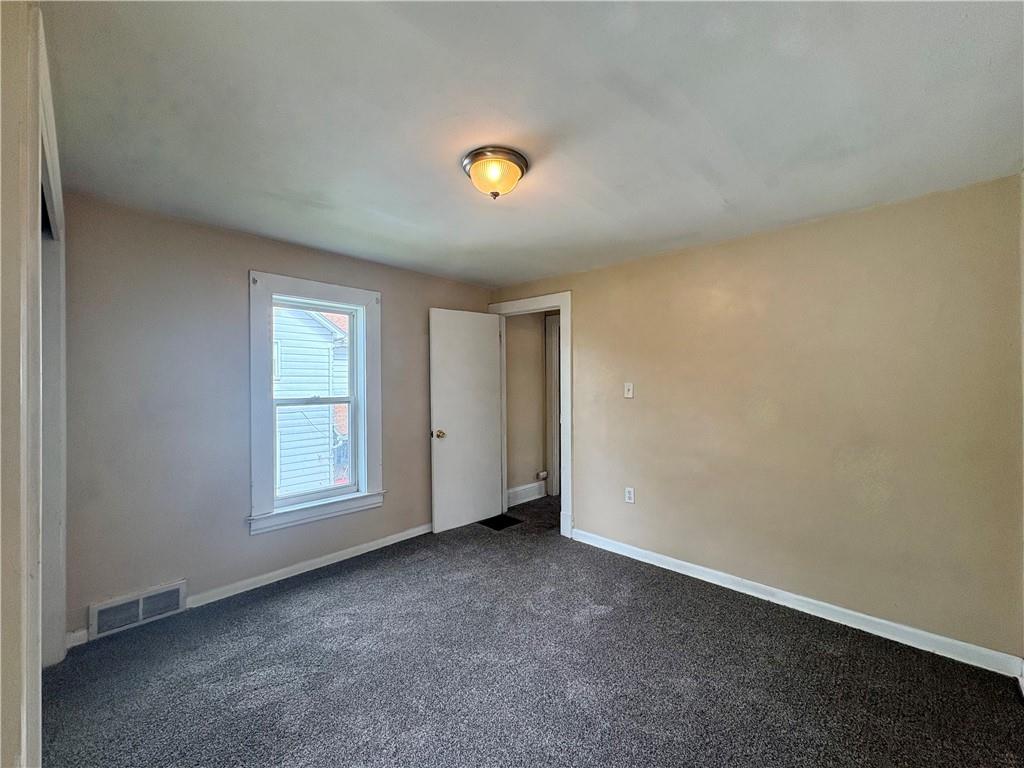 442 Park Street Rochester, PA 15074 - Photo 26 of 31 an empty room with windows and closet