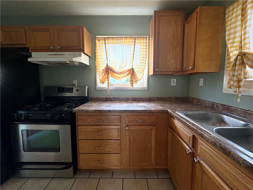 442 Park Street Rochester, PA 15074 - Photo 8 of 31 a kitchen with a sink stove and microwave