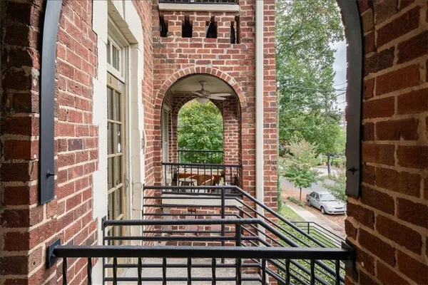 a view of balcony with wooden floor