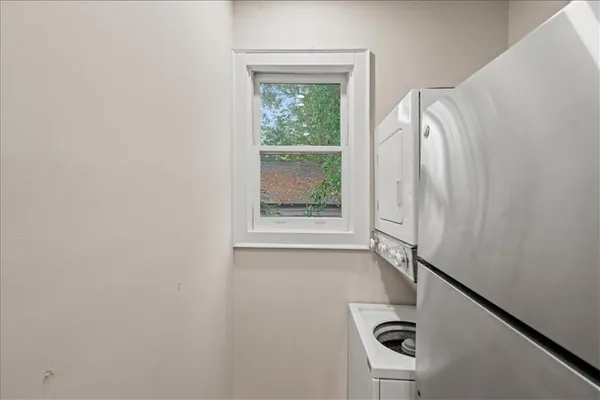 a bathroom with a bathtub and a window
