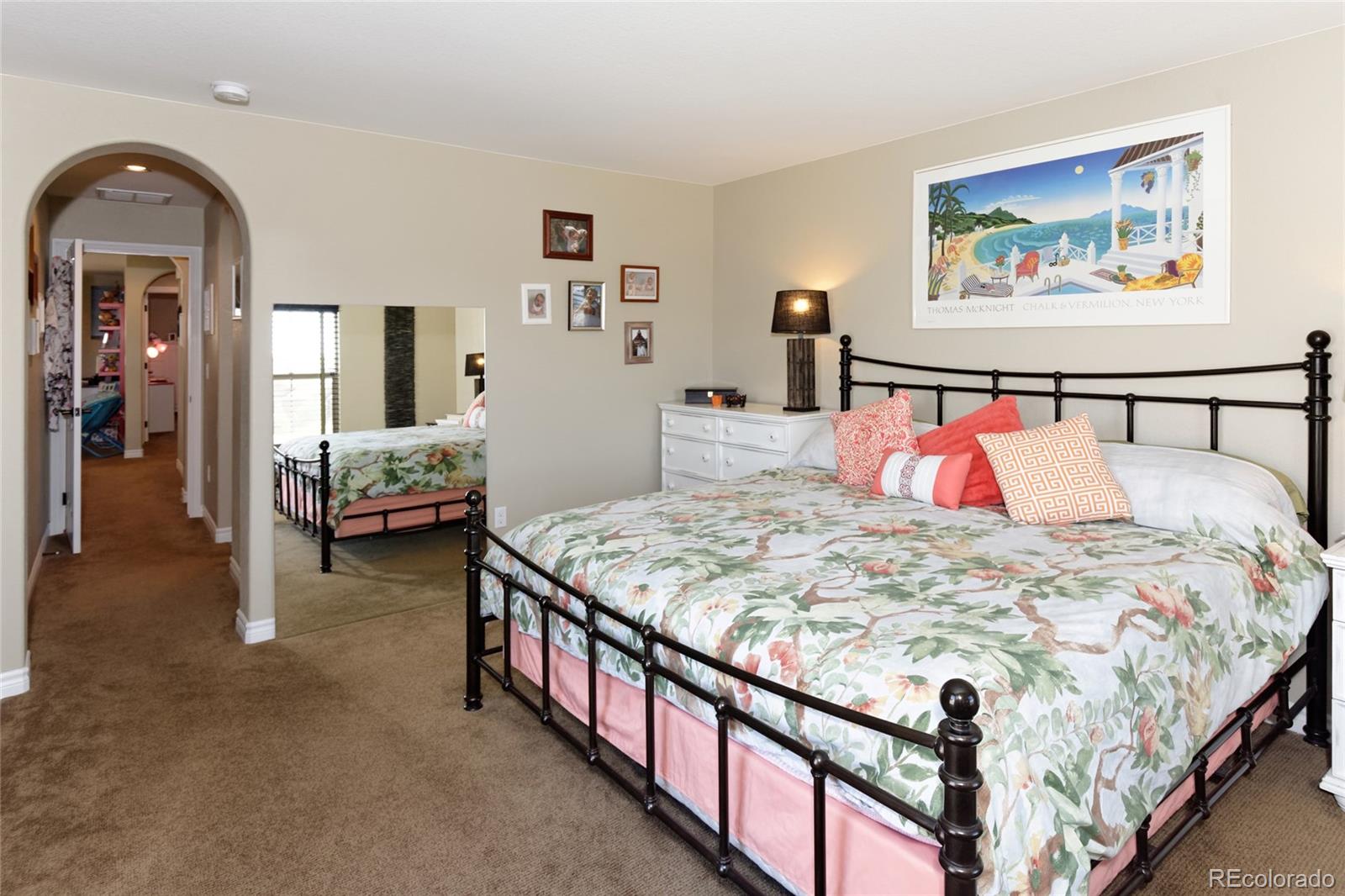9278 Viaggio Way Highlands Ranch, CO 80126 - Photo 17 of 35 a bedroom with bed and furniture