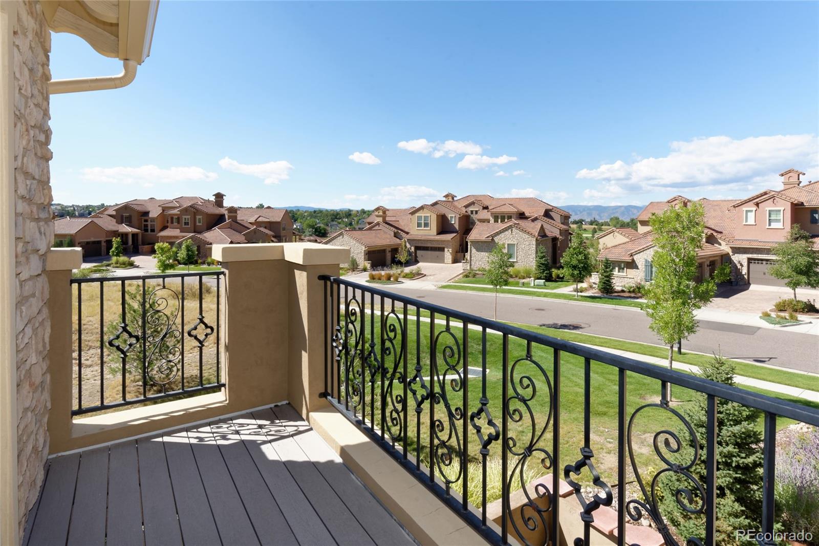 9278 Viaggio Way Highlands Ranch, CO 80126 - Photo 19 of 35 a view of a balcony with wooden floor