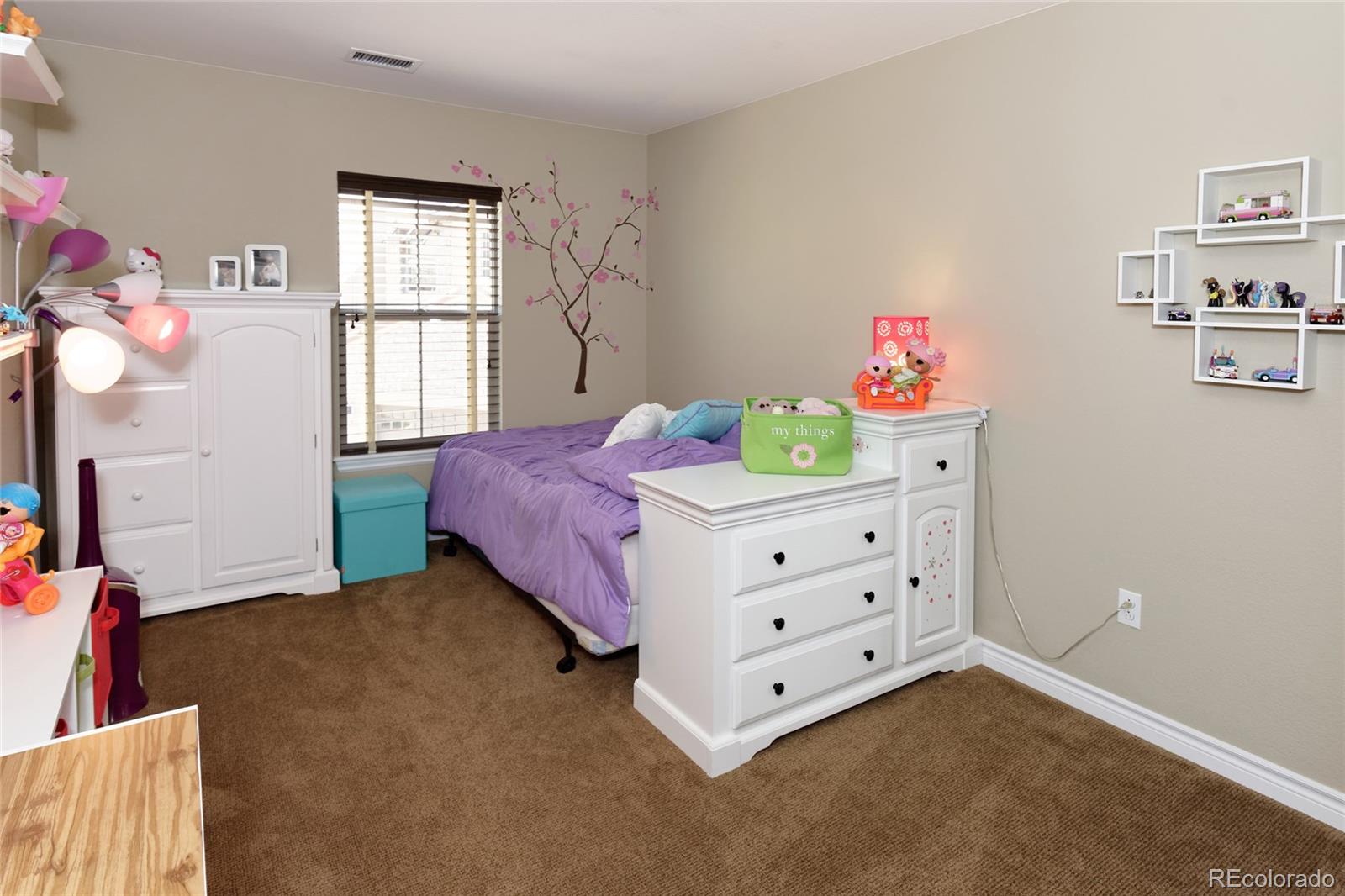 9278 Viaggio Way Highlands Ranch, CO 80126 - Photo 23 of 35 a bedroom with a bed and a window