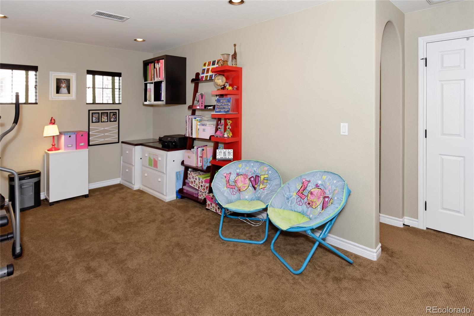 9278 Viaggio Way Highlands Ranch, CO 80126 - Photo 28 of 35 a workspace with furniture and toys
