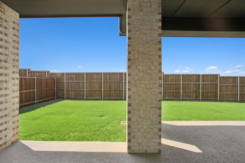 605 Derby Drive Mansfield, TX 76063 - Photo 2 of 13 a view of yard with a wooden fence