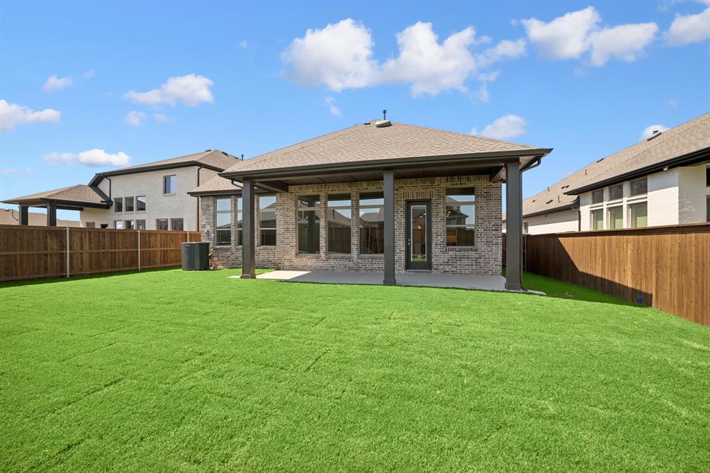 605 Derby Drive Mansfield, TX 76063 - Photo 4 of 13 a view of a house with a backyard