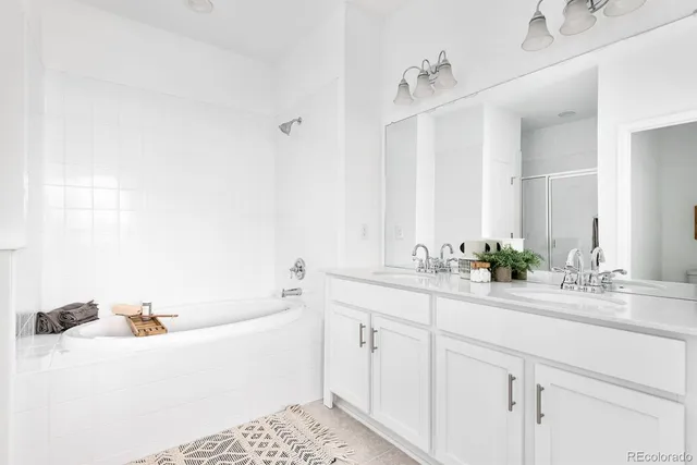 a bathroom with a bathtub and a sink