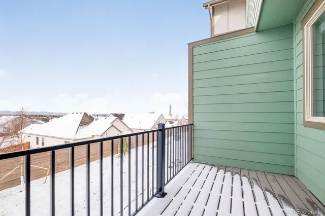 a view of a balcony with wooden floor