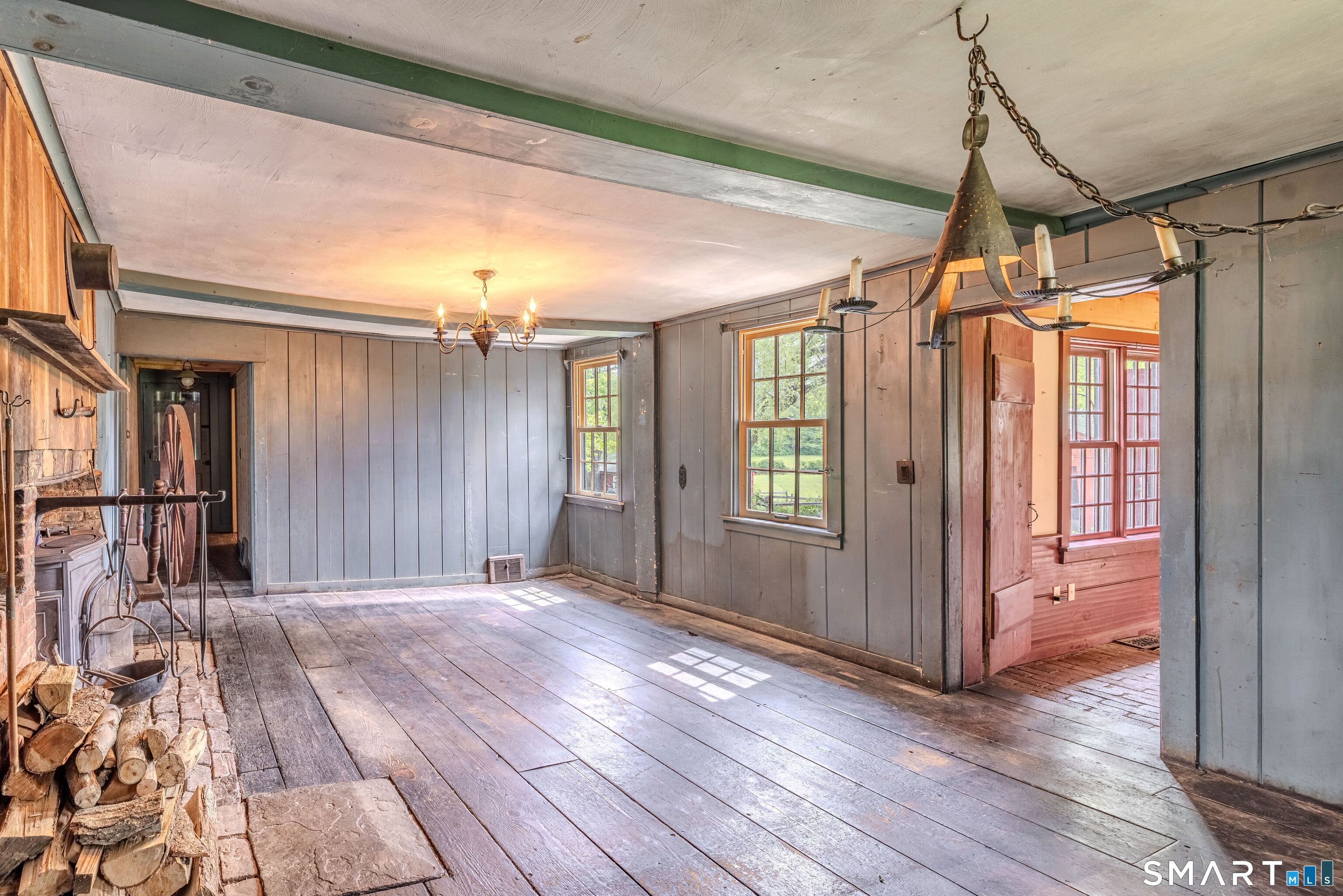 261 Hebron Road Bolton, CT 06043 - Photo 16 of 40 a view of a room with wooden floor and windows