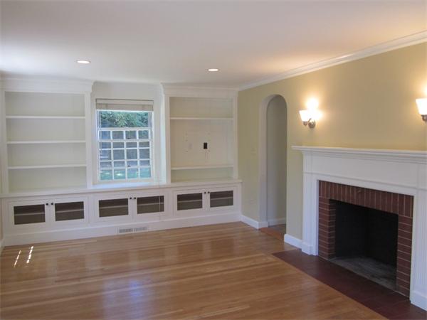 175 Broad Meadow Road Needham, MA 02492 - Photo 5 of 11 a living room with stainless steel appliances wooden floor and a fireplace