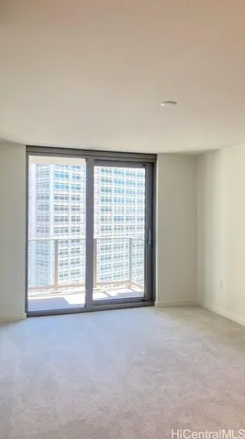 a view of an empty room with a window