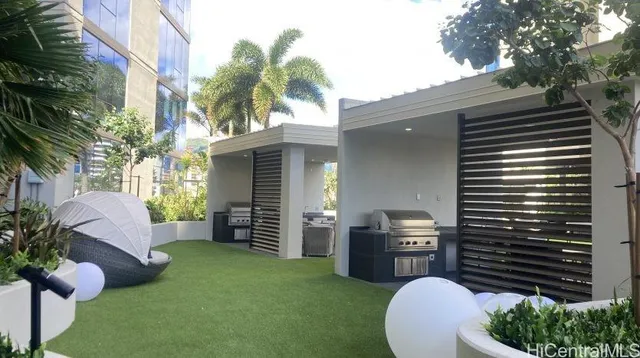 a view of a patio with couches and potted plants