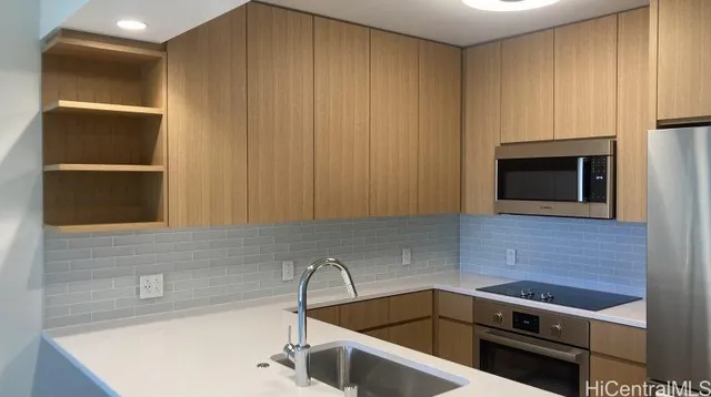 a kitchen with a sink and a microwave