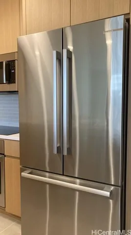 a view of a refrigerator in kitchen