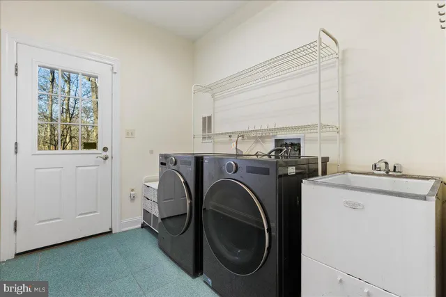 a utility room with dryer and washer