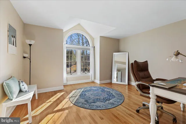 a workspace with furniture and a window