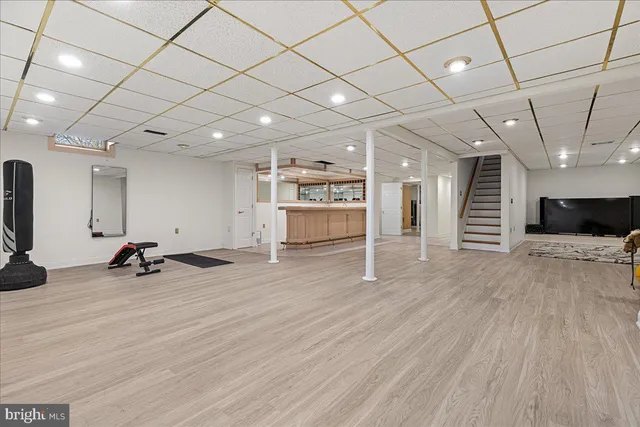 a view of a room with wooden floor