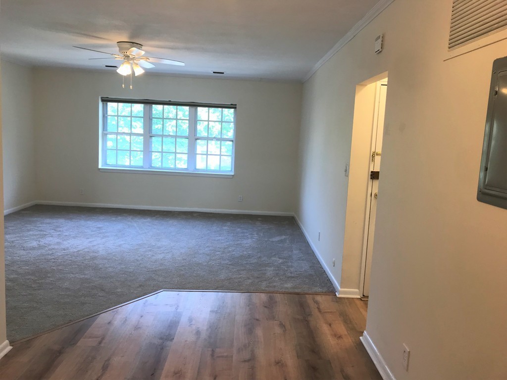 157 Lake Shore Road, Unit 4 Boston, MA 02135 - Photo 5 of 11 wooden floor in an empty room with a window