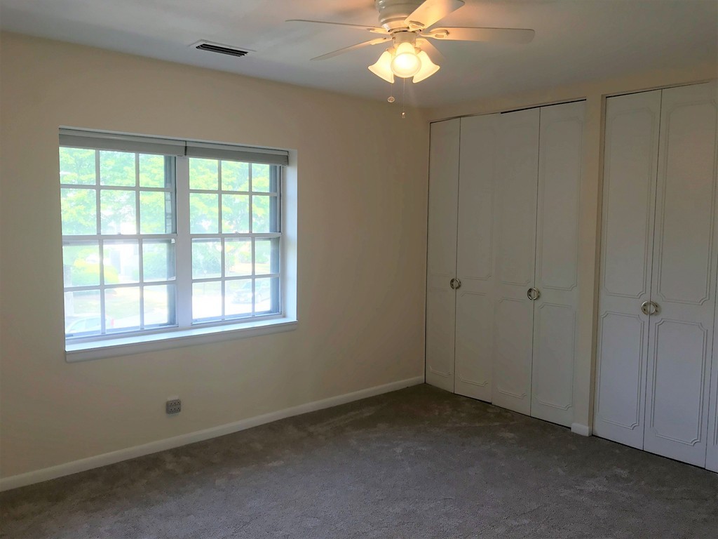 157 Lake Shore Road, Unit 4 Boston, MA 02135 - Photo 6 of 11 an empty room with a window