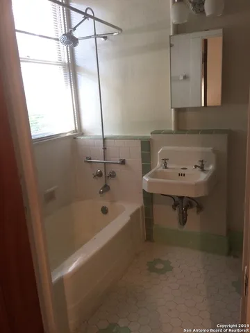 a view of wooden door and front door