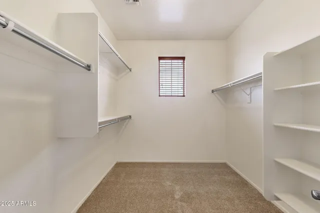 a view of an empty walk in closet