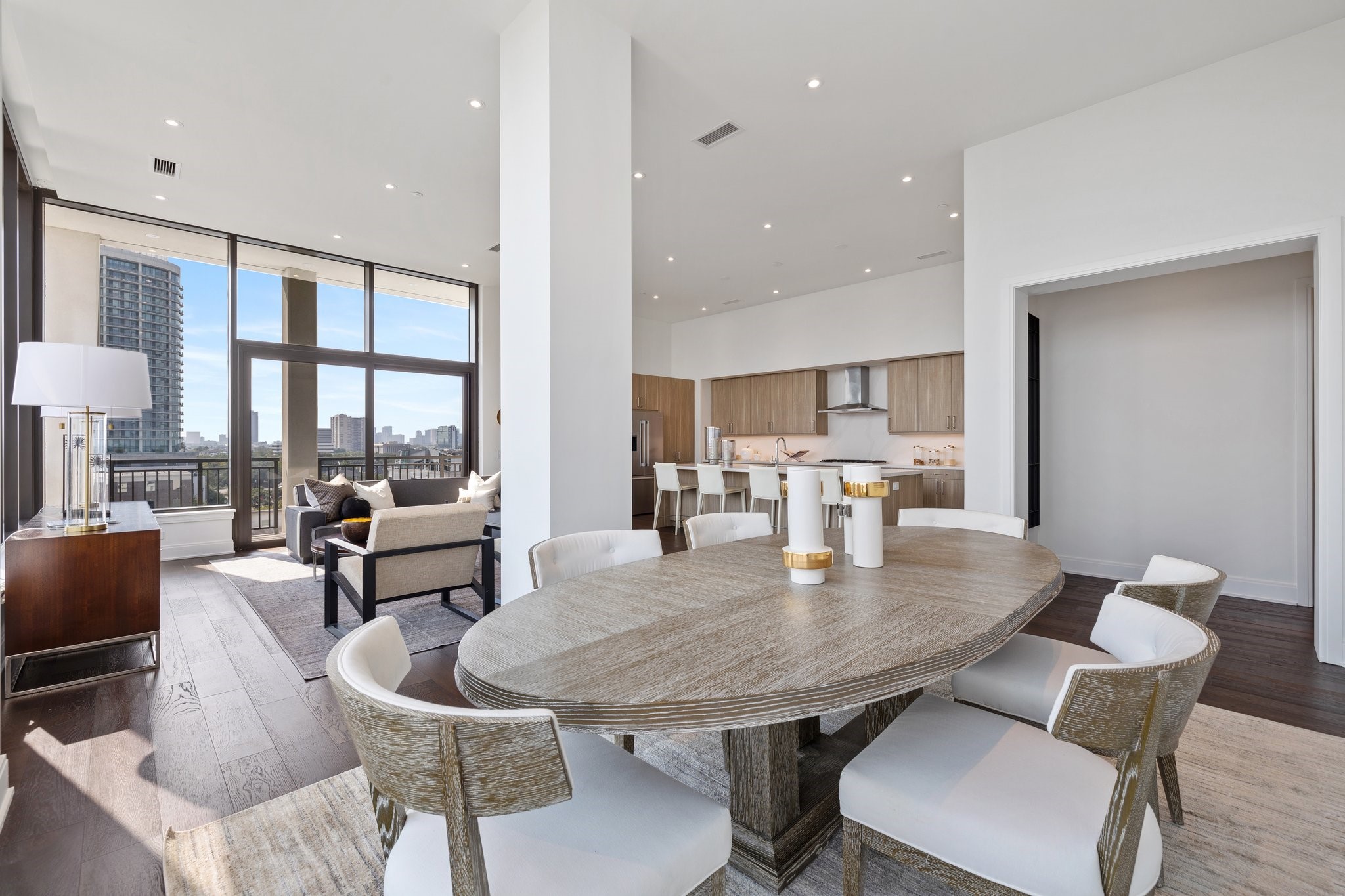 2323 West Main Street, Unit 703 Houston, TX 77098 - Photo 6 of 24 a dining room with furniture a large window and a potted plant