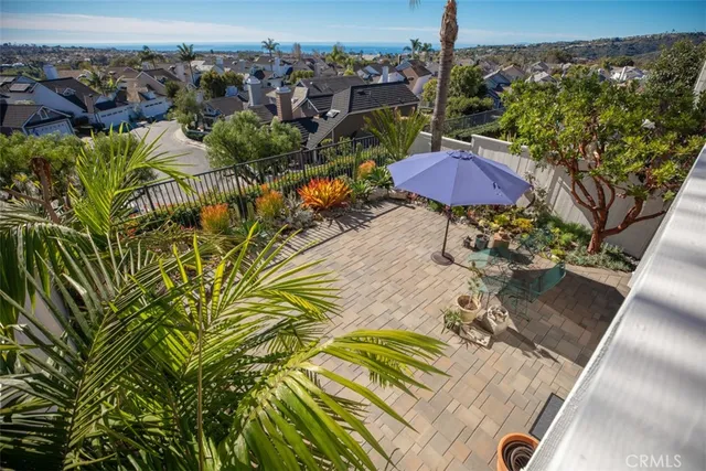 a bedroom with a bed and a bookshelf with wooden floor