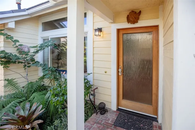 a view of a house with a door and balcony