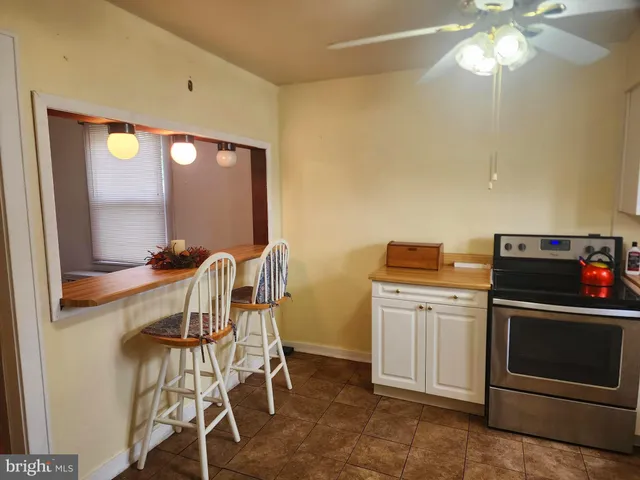 a kitchen with a stove and a microwave