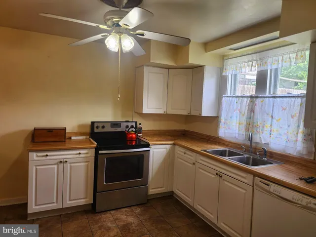 a kitchen with a stove and a sink