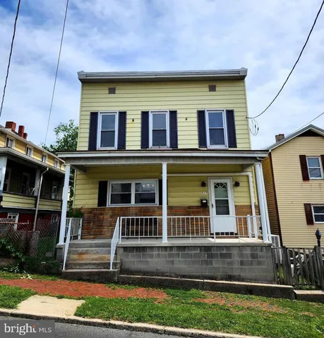 a front view of house with street