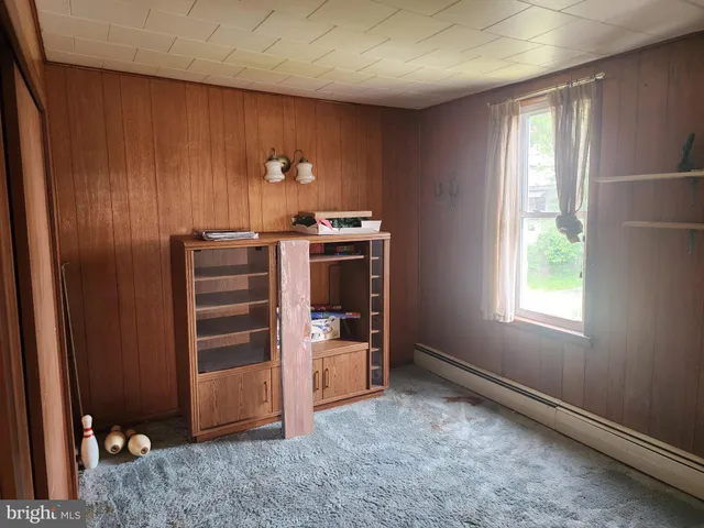 a view of room with furniture and windows