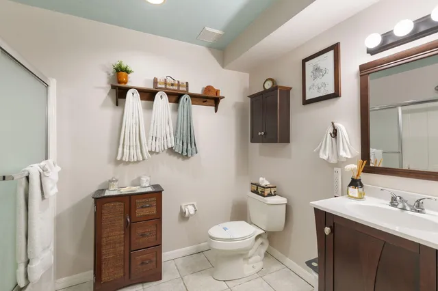 a view of a dining room with furniture and a chandelier