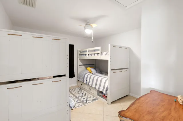 a view of a house with swimming pool and sitting area