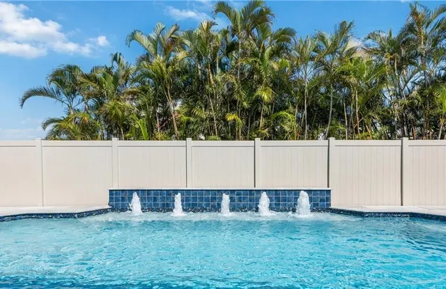 an aerial view of residential building with yard