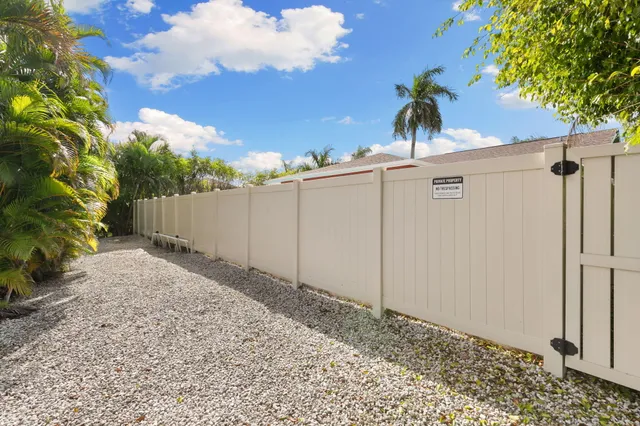an aerial view of residential houses with outdoor space and swimming pool