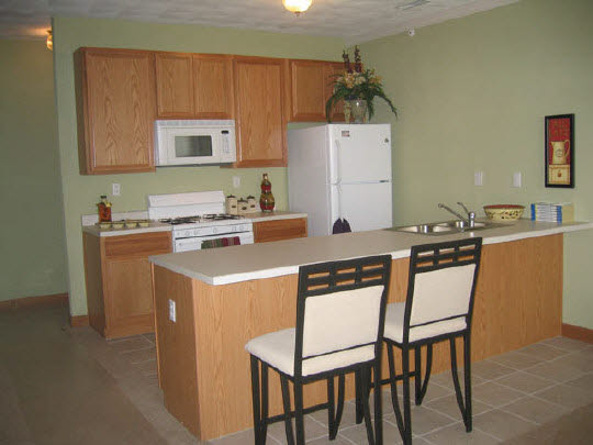 10372 Marblewing Road Roscoe, IL 61073 - Photo 4 of 7 a kitchen with a dining table chairs and a refrigerator