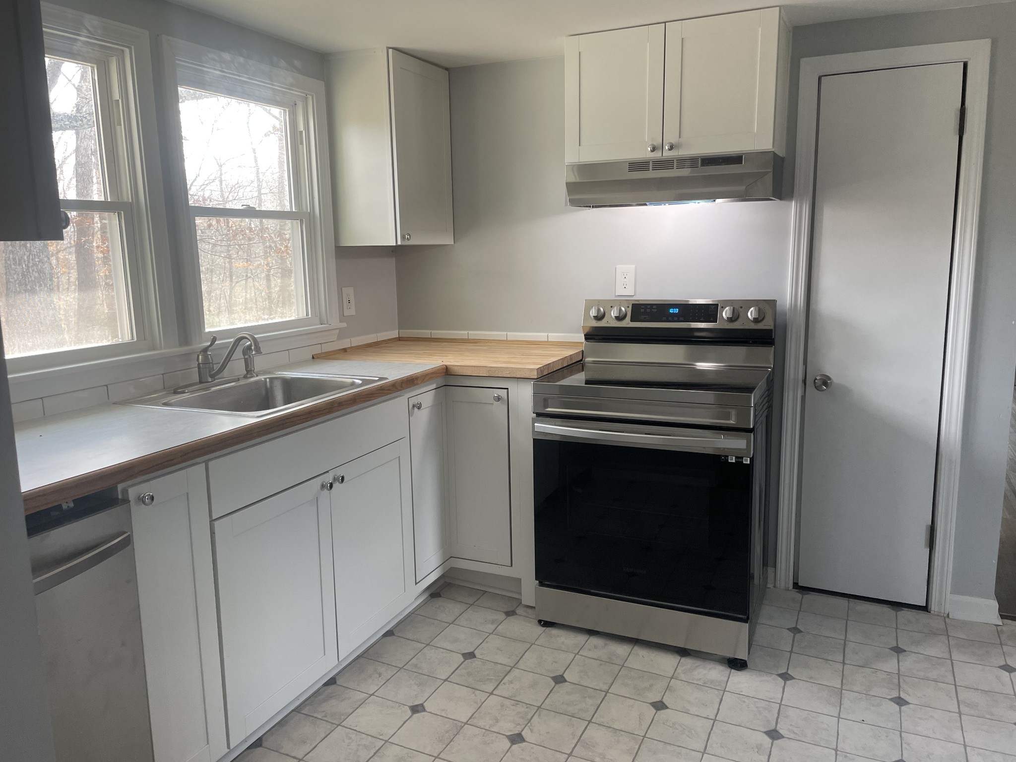 1808 Grays Bend Road Centerville, TN 37033 - Photo 5 of 18 a kitchen with cabinets appliances and a sink