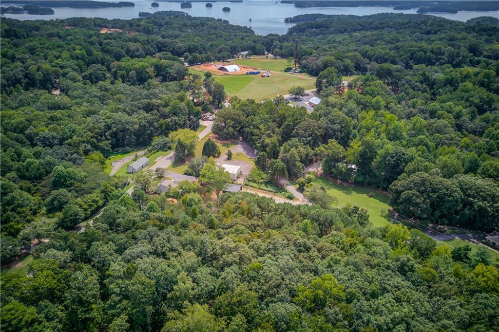 6700 Shady Grove Road Cumming, GA 30041 - Photo 20 of 69 an aerial view of residential houses with outdoor space and trees all around