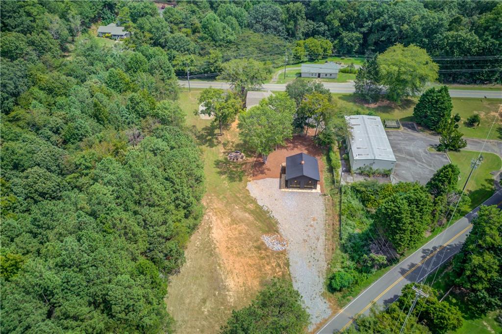 6700 Shady Grove Road Cumming, GA 30041 - Photo 23 of 69 an aerial view of a house with a yard basket ball court and outdoor seating