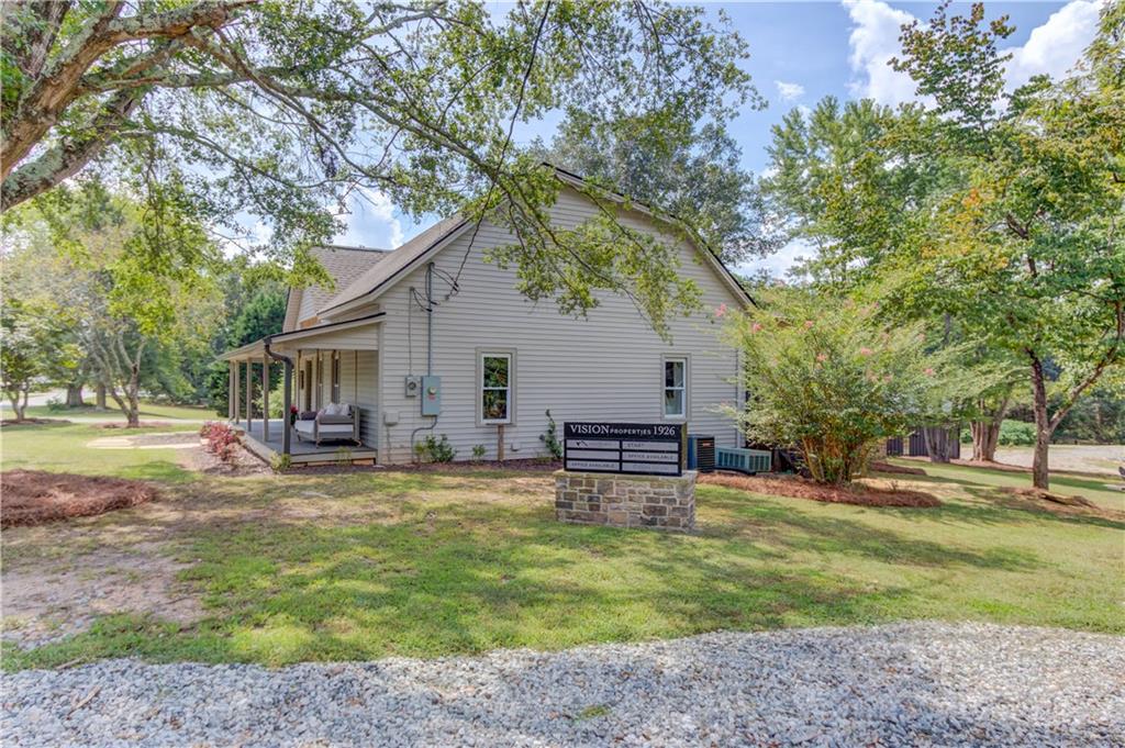 6700 Shady Grove Road Cumming, GA 30041 - Photo 25 of 69 a view of a house with backyard and sitting area
