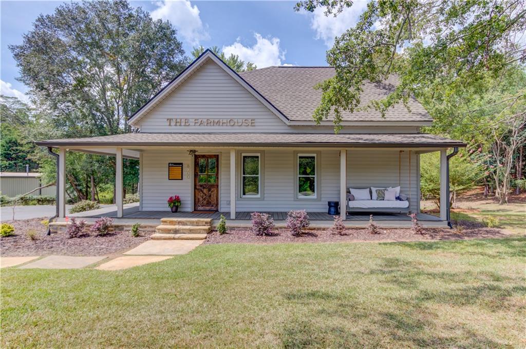 6700 Shady Grove Road Cumming, GA 30041 - Photo 27 of 69 a front view of house with outdoor seating and green space