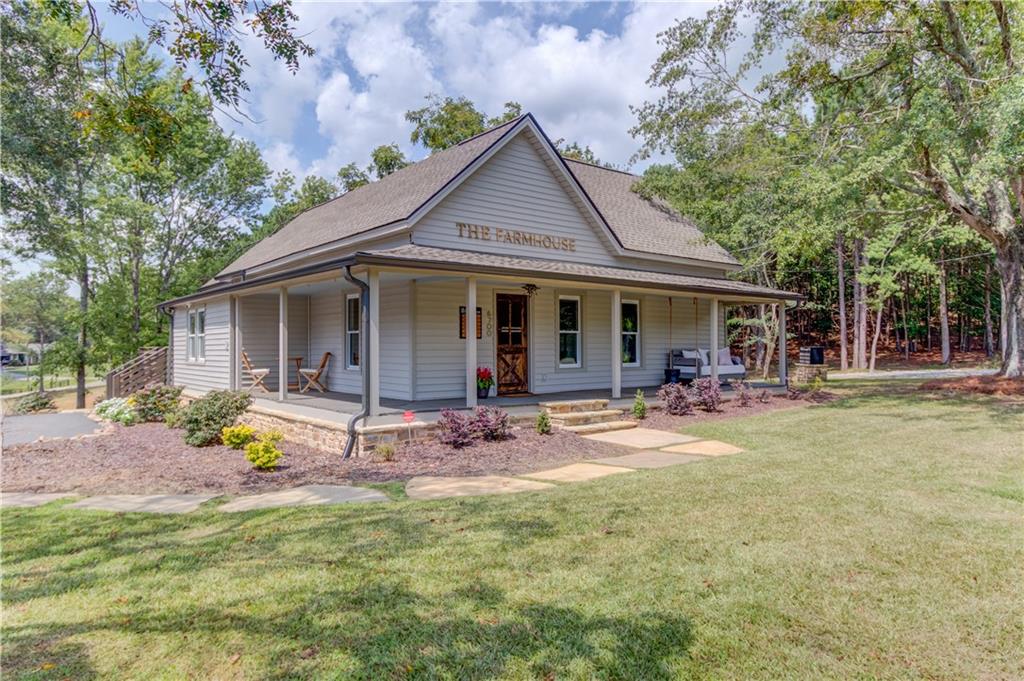 6700 Shady Grove Road Cumming, GA 30041 - Photo 28 of 69 a view of a house with a yard patio and wooden fence
