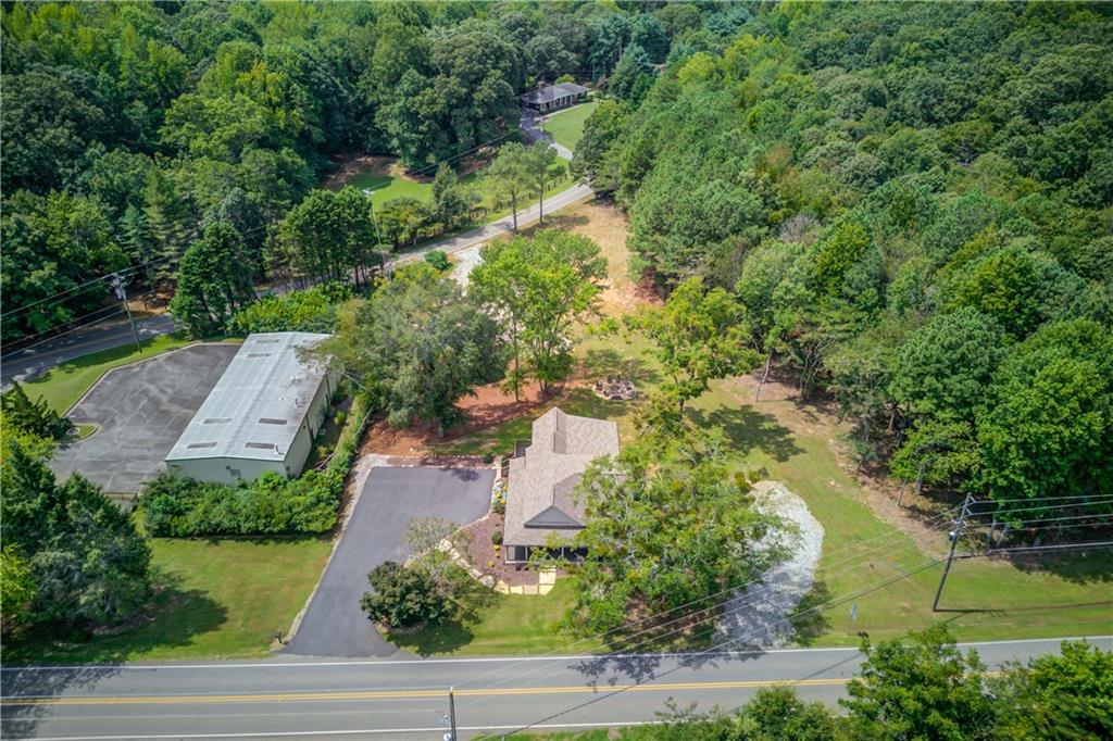 6700 Shady Grove Road Cumming, GA 30041 - Photo 4 of 69 an aerial view of residential houses with outdoor space and trees