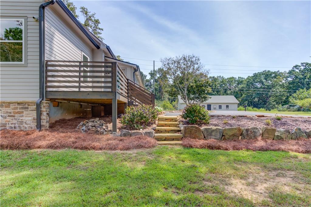 6700 Shady Grove Road Cumming, GA 30041 - Photo 48 of 69 a view of a house with a yard and sitting area