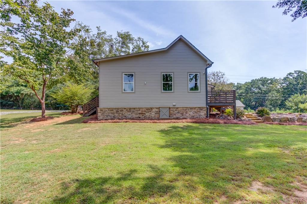 6700 Shady Grove Road Cumming, GA 30041 - Photo 49 of 69 a view of a house with a yard