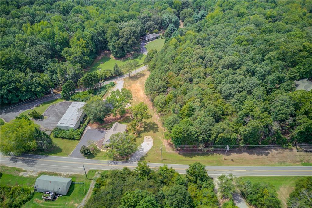 6700 Shady Grove Road Cumming, GA 30041 - Photo 5 of 69 an aerial view of residential house with outdoor space and trees all around