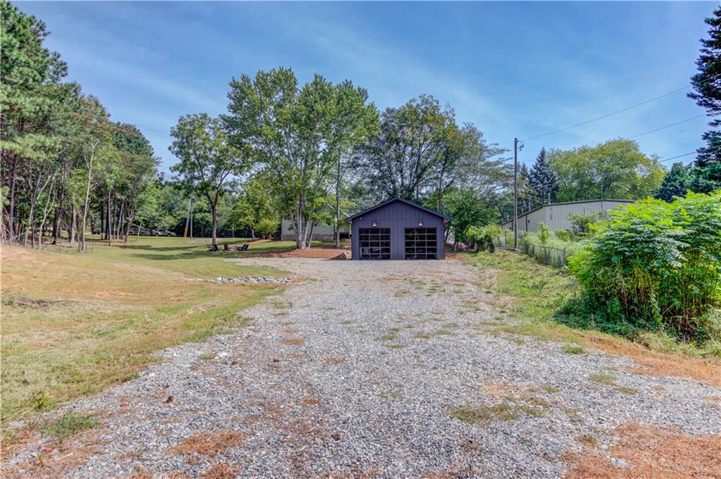 6700 Shady Grove Road Cumming, GA 30041 - Photo 54 of 69 a front view of a house with a yard
