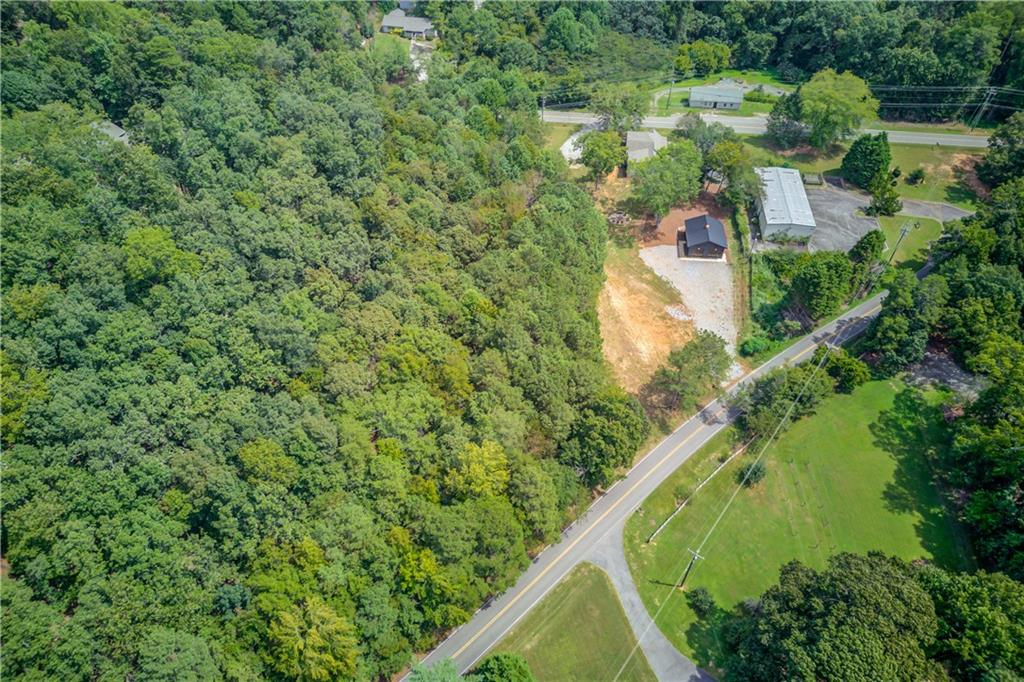 6700 Shady Grove Road Cumming, GA 30041 - Photo 7 of 69 an aerial view of residential house with outdoor space and trees all around