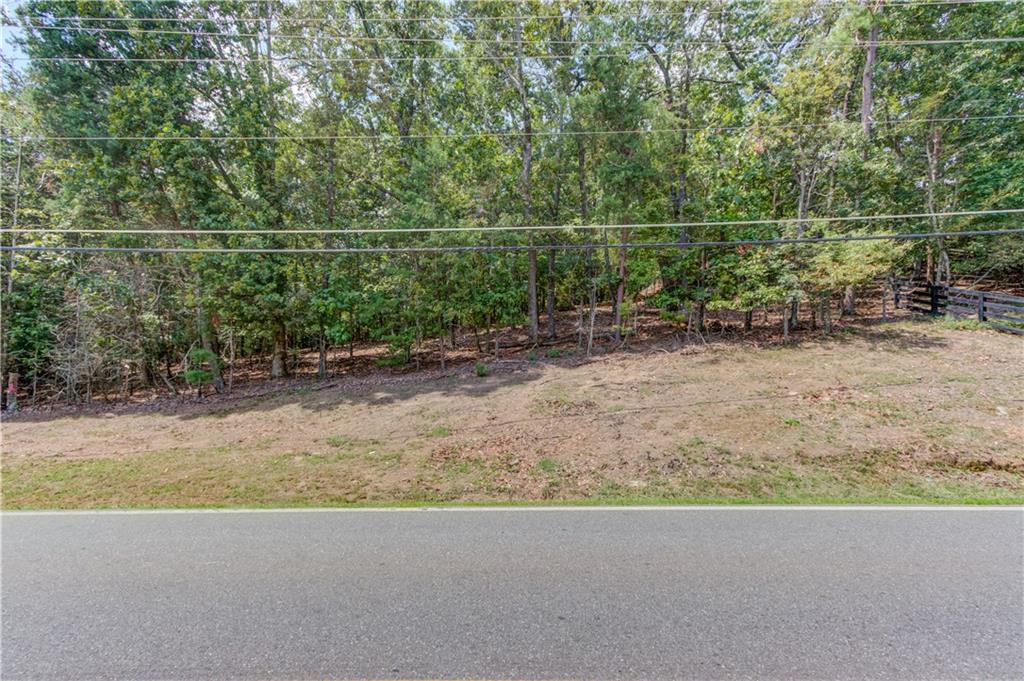 6700 Shady Grove Road Cumming, GA 30041 - Photo 10 of 69 a view of a dry yard with wooden fence
